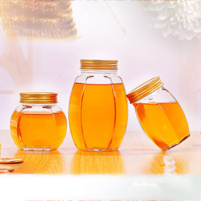 Récipient d'entreposage recyclable de nourriture de miel de couvercle en métal de pot de forme en verre d'hexagone fournisseur